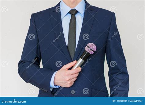 Man In Business Suit Holding A Microphone Stock Image Image Of