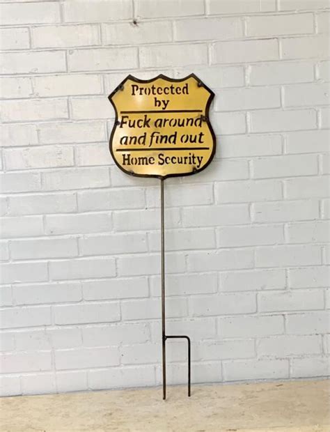 Protected By Fuck Around And Find Out Sign With Chain Or Stake El