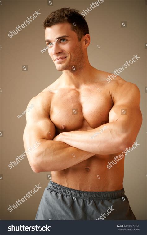 Smiling Handsome Man Muscular Arms Crossed Stock Photo