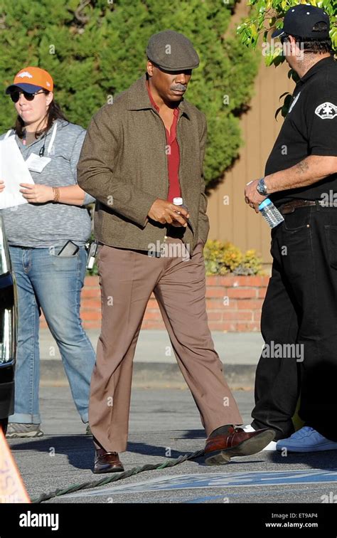 Actor Eddie Murphy Sports A Grey Mustache And 70s Attire On The Set Of