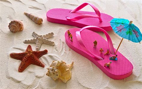 Pink Flip Flops In The Sand