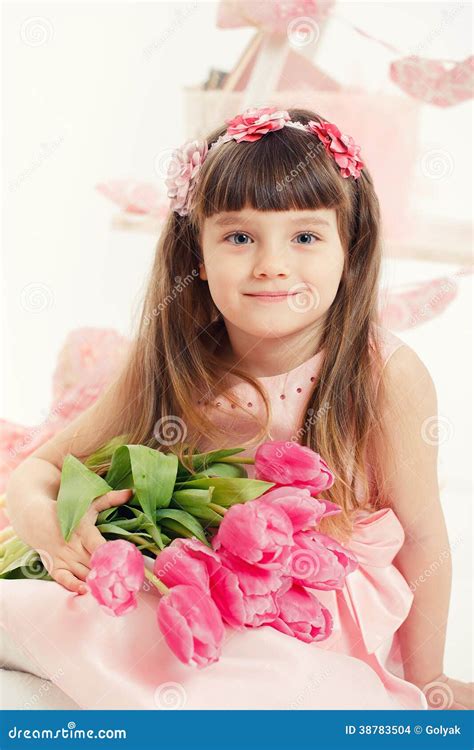 Portrait of a Beautiful Little Girl with Flowers Stock Photo - Image of fashion, cute: 38783504