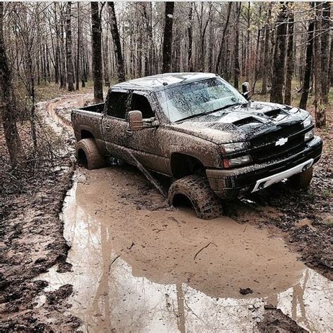 Muddy Jacked Up Chevy Trucks