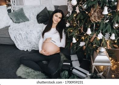 Beautiful Pregnant Brunette Girl Sitting On Stock Photo Shutterstock