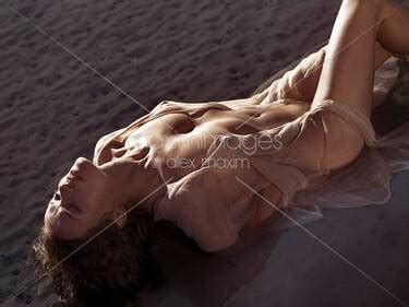 Photo Of Dramatic Portrait Of A Beautiful Half Naked Woman Lying In