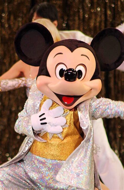 A Person In A Mickey Mouse Costume On Stage