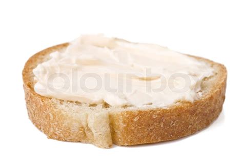 Scheibe Brot mit Käse Creme verteilen darauf Stock Bild Colourbox