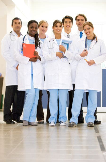 group of doctors smiling and standing in a hospital | Freestock photos