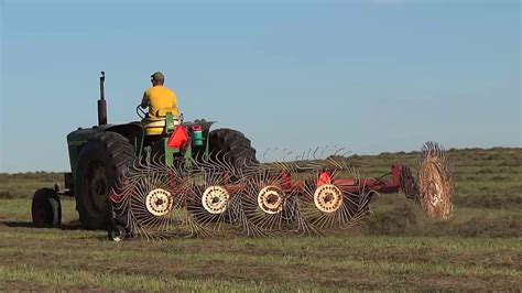 Cutting Raking And Baling Hay Youtube