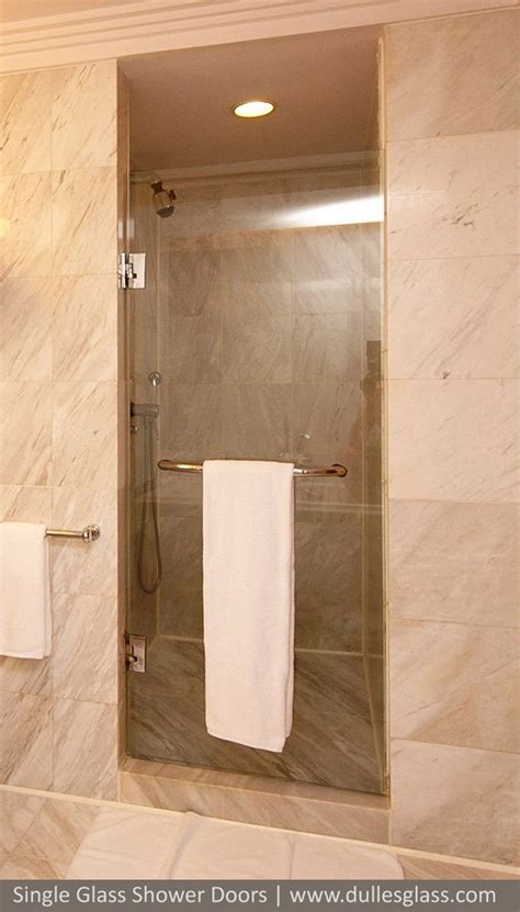 This Single Shower Door Features A Towel Bar Combination Handle For A