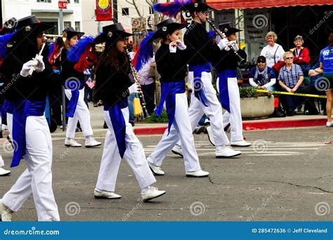 Young Teen Girls And Boy Marching Band In Small Town Parade Editorial