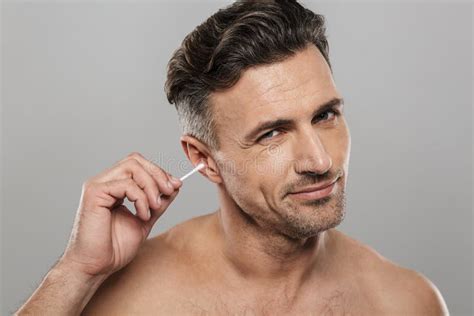 Handsome Mature Man Holding Cotton Bud Take Care Of His Ears Cleaning
