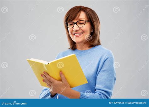 Portrait Of Senior Woman In Glasses Reading Book Stock Image Image Of