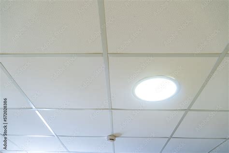 Suspended Ceiling Made Of Square Plasterboard Slabs With Built In Round Led Lighting Close Up