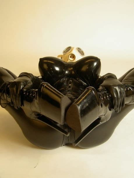 Solo Model Darkwing Zero Sports A Gas Mask While Modelling Latex