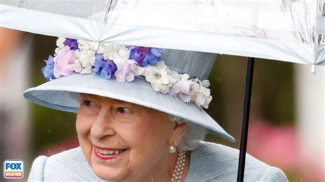 A royal 'brolly': Queen's love of umbrellas sheltered her humble style ...