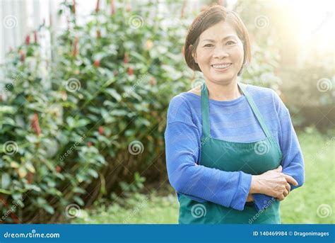 Mature Woman In The Garden Stock Photo Image Of Countryside