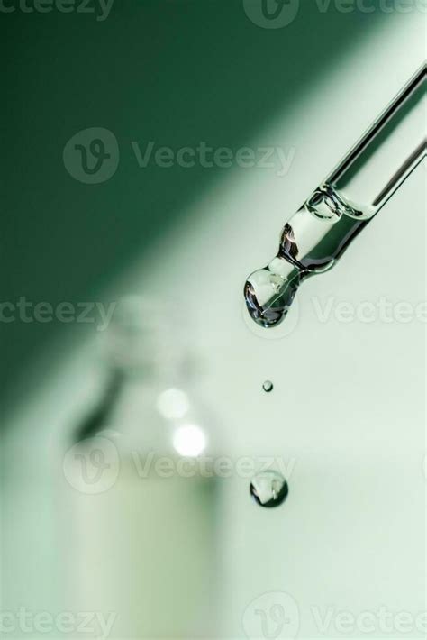 A Drop Of Cosmetic Oil Falls From The Pipette Stock Photo At