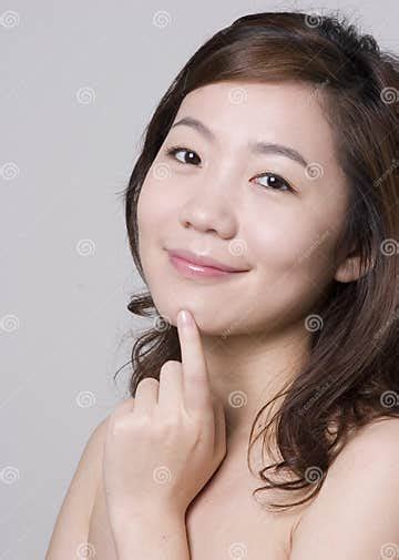 Smiling Asian Girl With A Finger Touching Her Chin Stock Image Image Of Cheerful Health 13834543