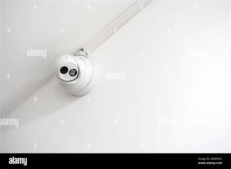 single simple security camera   white wall modern real estate