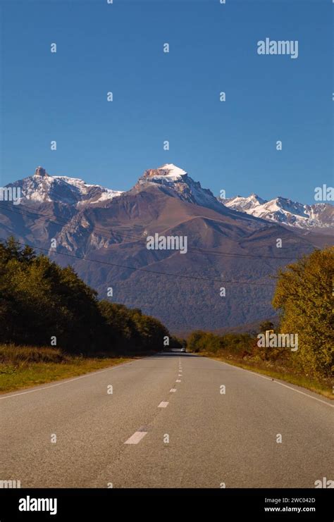 A Breathtaking Landscape With Majestic Rocky Mountains Shrouded In The
