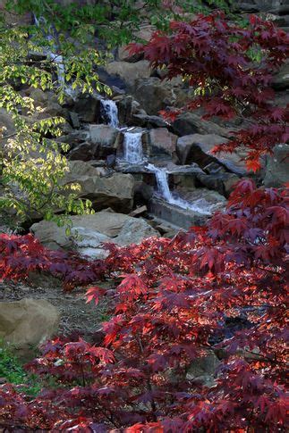 This Gorgeous Waterfall And Bright Foliage Can Be Found At Honor