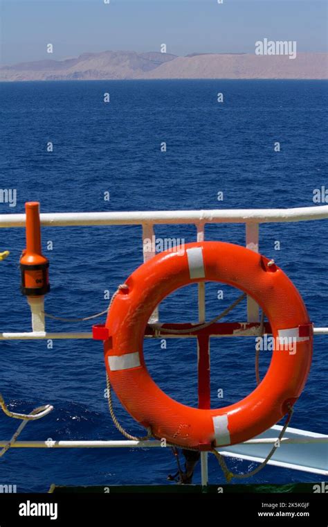 View Of A Lifebuoy With Self Igniting Light Fitted On The Guardrails Of