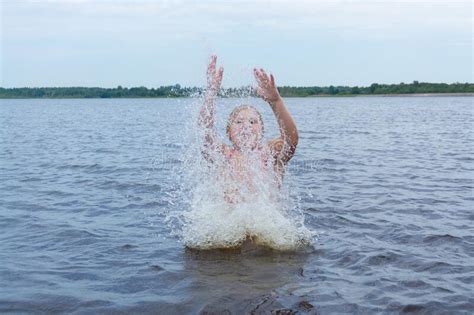 The Girl Frolics In The Water On A Hot Sunny Summer Day And Is Happy Kuvshinovo Tver Region