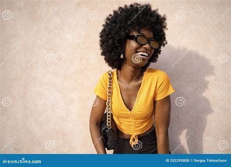 Happy African Young Woman With Afro Hair Wearing Stylish Sunglasses