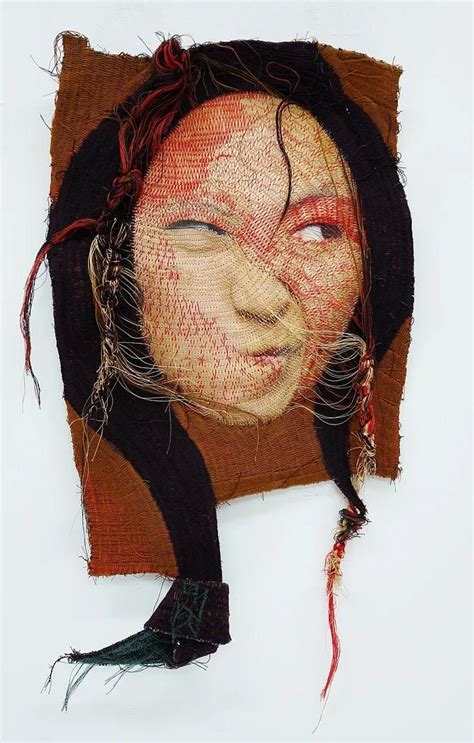 A Woman S Head Is Made Out Of Woven Material And Has Hair On It