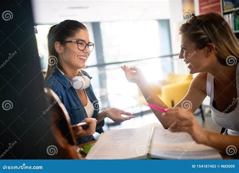 Group Of Friends Studying Together At University Campus Stock Photo