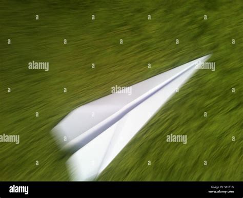 Paper plane in flight Stock Photo - Alamy