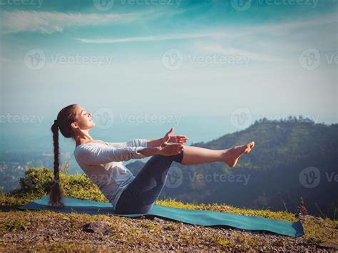 Woman Doing Ashtanga Vinyasa Yoga Asana Navasana Boat Pose