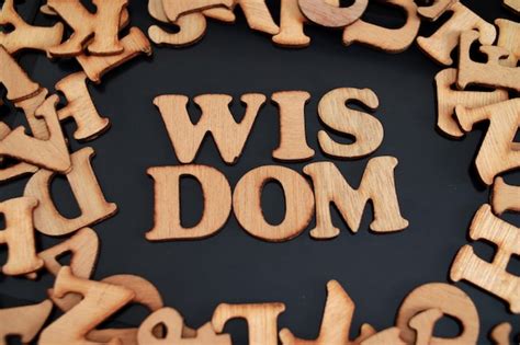 premium photo wisdom text words typography written  wooden life