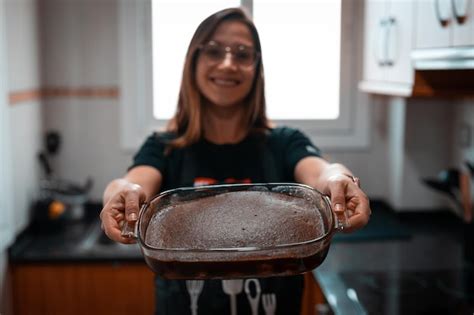 Premium Photo Portrait Of Smiling Woman Standing At Home