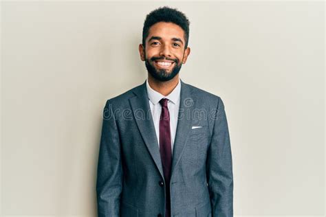 Handsome Hispanic Man With Beard Wearing Business Suit And Tie With A