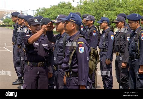 Indonesian police officers in central Jakarta practising marching and ...