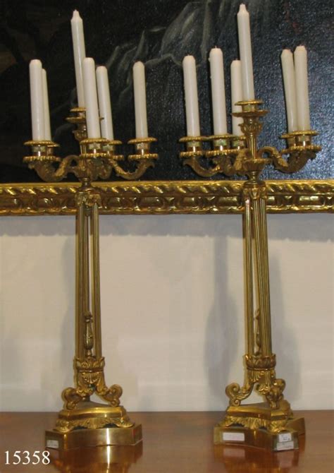 Pareja de Candelabros de bronce dorado con oro fino Imperio Inglés