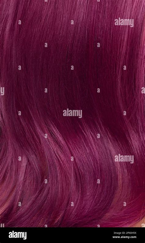 A closeup view of a bunch of shiny straight purple hair in a wavy ...