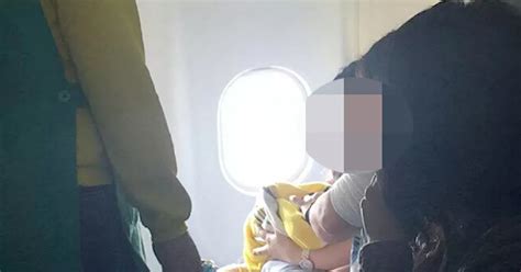 Beautiful Moment Plane Passenger Cradles Newborn In Her Arms After