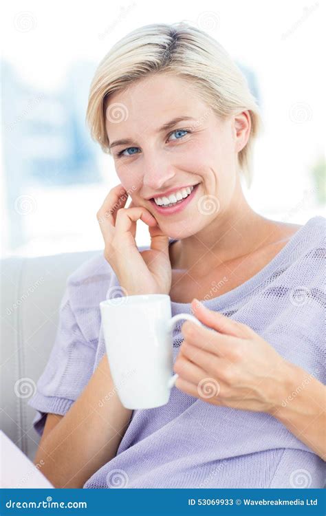 Pretty Blonde Woman Sitting On The Couch And Holding A Mug Stock Image Image Of Gorgeous Hair