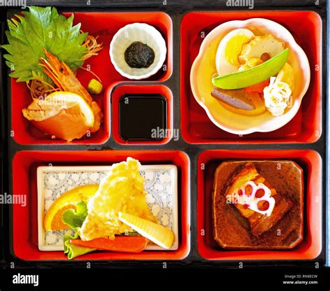 Traditional wooden Japanese Bento box with lunch foods Stock Photo - Alamy