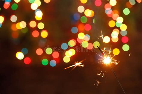 Beautiful Sparklers On The Background Of A Garland Beautiful Holiday