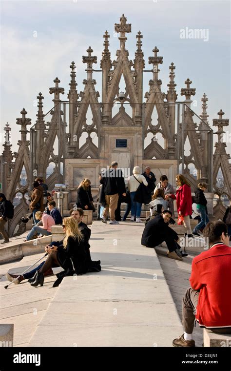 Tourists visiting and relaxing on rooftop of Milan Cathedral Milano Lombardy northern Italy ...