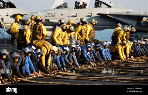 Us Navy Flight Deck Personnel Participate In An Aircraft Barricade Drill On The Flight Deck