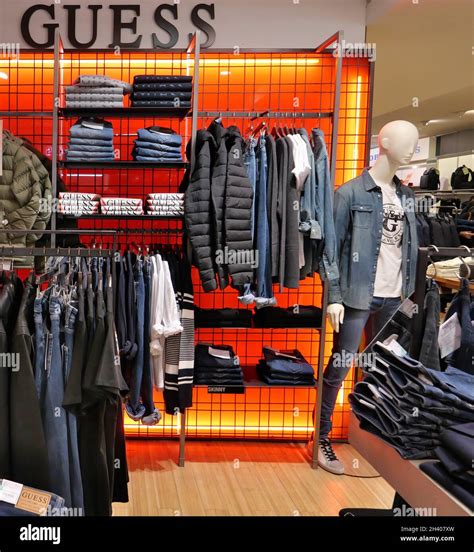 GUESS CLOTHING ON DISPLAY INSIDE THE FASHION STORE Stock Photo - Alamy