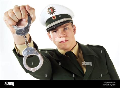 Young Police Officer Holding Handcuffs Stock Photo Alamy