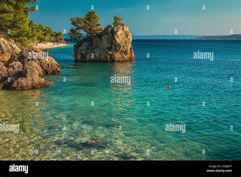 Stunning Landscape With Clean Sea And Majestic Rock Island On The Beach