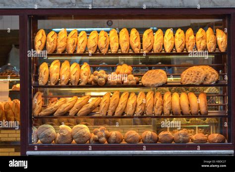 Baked bread on the bakery display window Stock Photo - Alamy