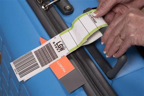 Airline Baggage Tag On Suitcase Handle Stock Editorial Photo